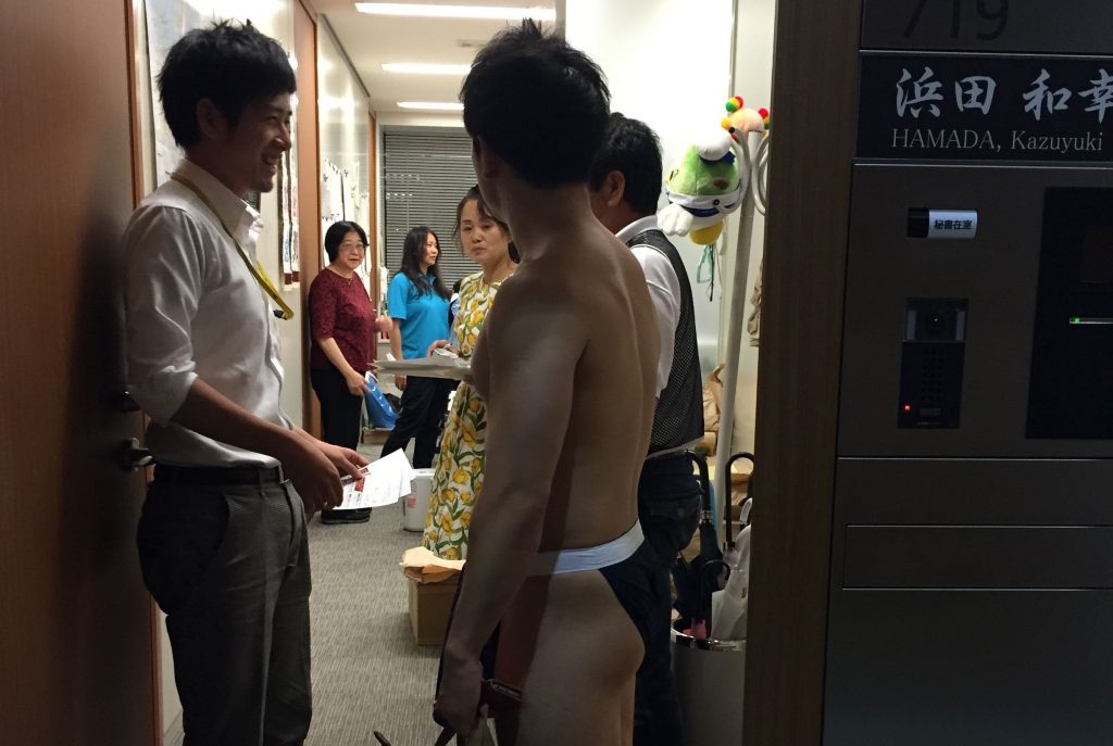 fundoshiman-surrounded-by-secretary